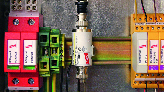 Surge arrester designed as cable adapter for protecting coaxial systems such as video and camera systems from potential damage.