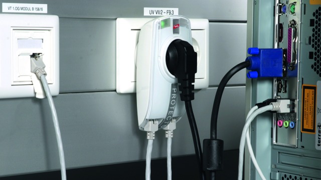 Combined surge protective adapter with visual operating state and fault indication plugged into an earthed socket outlet.
