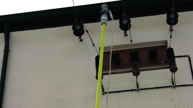 Telescopic earthing stick with aluminium cone coupling and phase screw clamp.