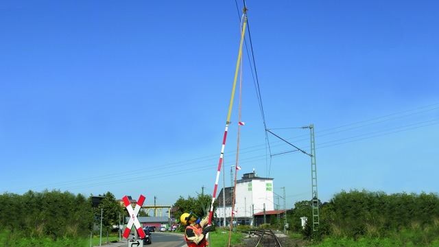 Attaching a railway earthing device.